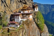 Closeup View of Tiger's Nest Monastery. The rock slopes are very steep (almost vertical) and the monastery buildings are built into the rock face. Though it looks formidable, the monastery complex has access from several directions, such as the northwest path through the forest, from the south along the path used by devotees, and from the north (access over the rocky plateau, which is called the “Hundred Thousand Fairies” known as Bumda.
